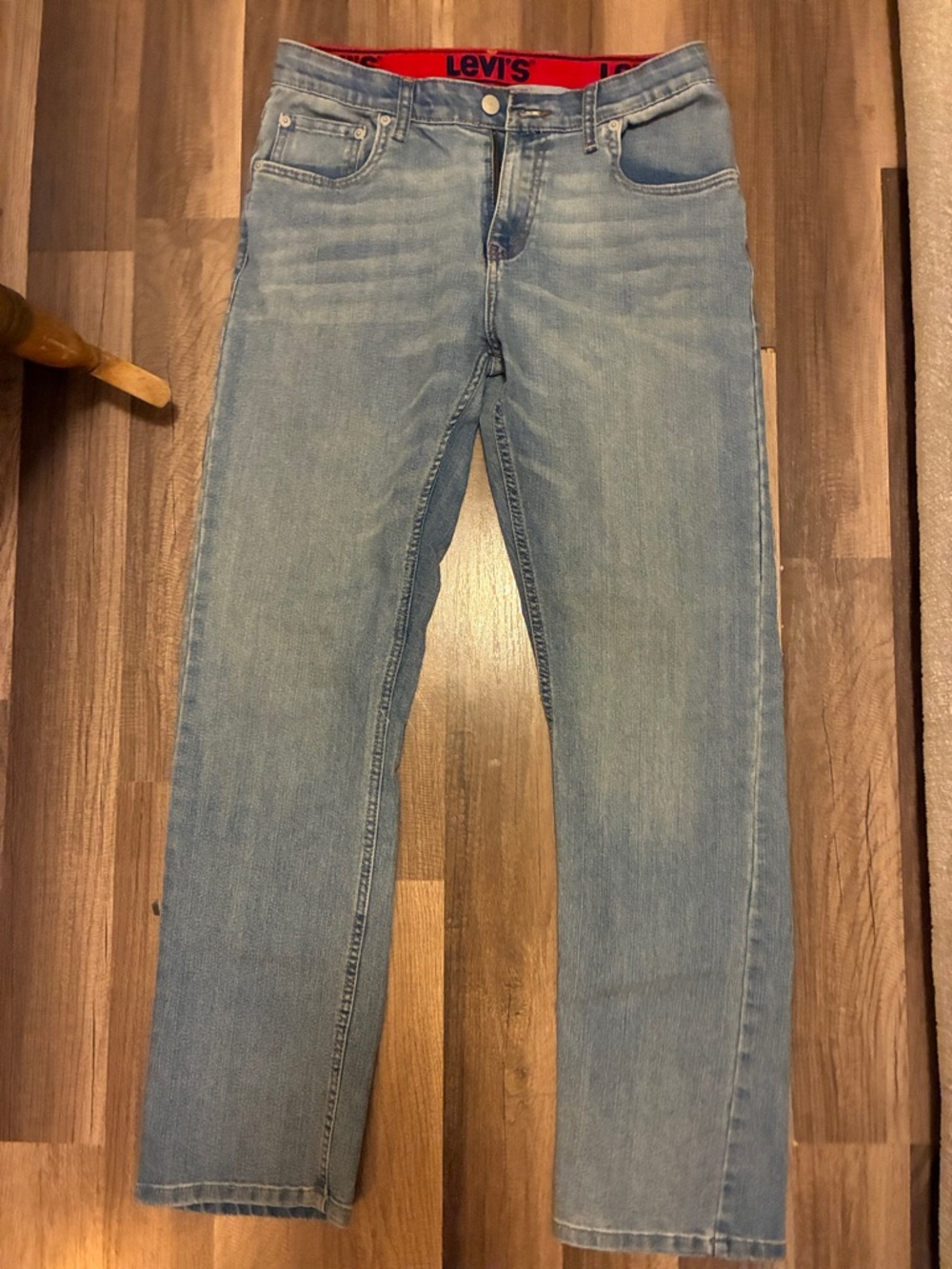 Levi's Men's Light Wash Straight Jeans with Red Waistband Accent